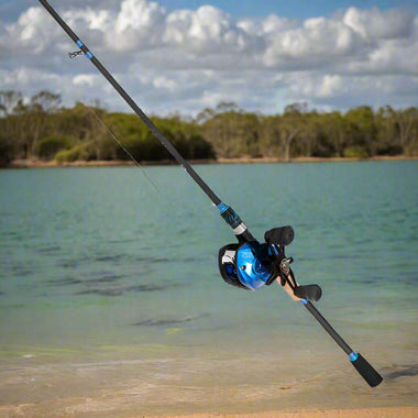 Bait cast combo fishing rod 2.1 meters with blue accents by the water, ideal for catching big fish.